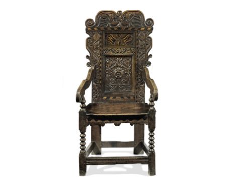 An impressive Charles II joined oak and inlaid panel-back open armchair, Yorkshire, circa 1670The back of two panels, having 