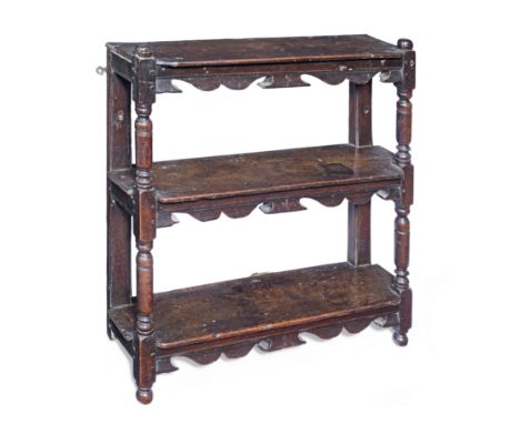 A rare and fine small set of Charles I oak mural shelves, circa 1630With three open shelves, each with bicuspid-shaped front 