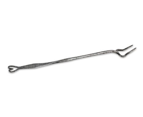 A George II iron meat fork, dated 1754Of two curving tines, the handle flattening into a lozenge, struck with the date '1754'