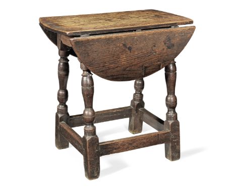 A Charles I joined oak stool-table, circa 1640 and laterThe drop-leaf top constructed from single-piece boards, and probably 