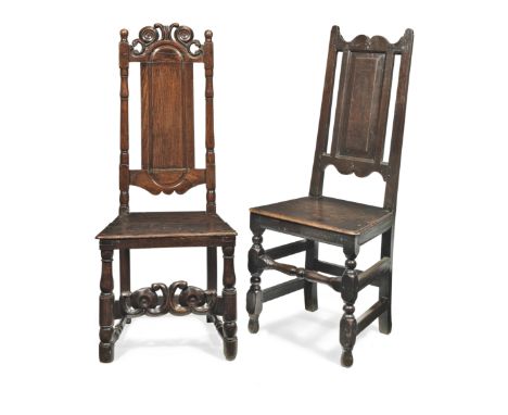 Two joined oak high-back side chairs, English, circa 1700-20One having a slender back panel below an ornate scroll-carved and