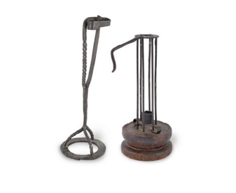 An 18th century wrought iron and beech 'stable' or 'birdcage' ejector candlestick, EuropeanWith crook handle, and iron slidin