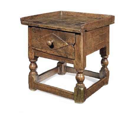 A 17th century small joined chestnut occasional table, SpanishHaving a boarded and three-quarter galleried top, a single draw