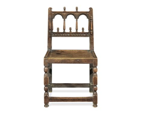 A Charles II oak backstool, Derbyshire, circa 1670Having a slender triple-arched top-rail, on baluster-turned spindles, the l