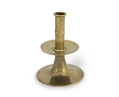 A good mid-17th century brass trumpet-based socket candlestick, English, circa 1660With narrow socket flange, faint medial kn