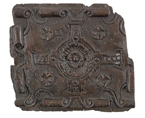 An early 17th century carved oak strapwork panel, English, circa 1620Centred by a large rosette with straps at the cardinal p