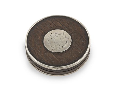 A white metal-mounted oak lidded circular snuff box, dated 1722With white metal rims and a circular plaque inscribed 'Sic tra