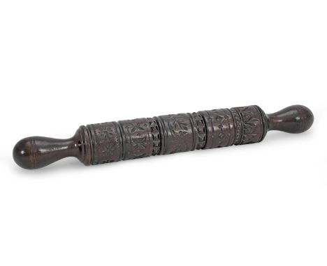 A 19th century carved fruitwood rolling pin, for butter or paste, WelshCentred by a vine of leaves and berries between furthe