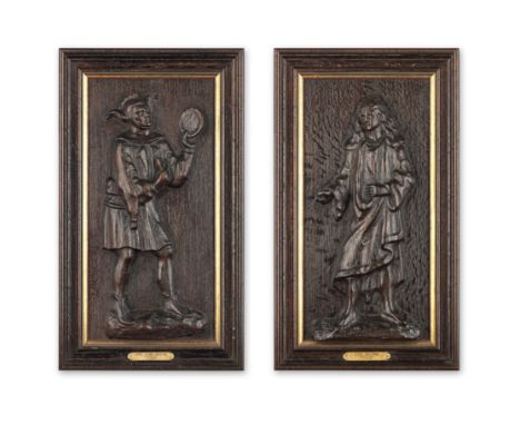 A pair of carved oak panels, probably 17th centuryOne of a Jester, with mirror, motley and a cap and bells, the second probab