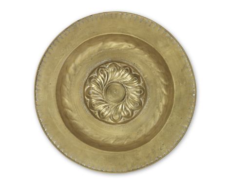 A mid- to late 16th century brass alms dish, Nuremberg, circa 1500-1550The central boss of twelve double-contoured gadroons, 
