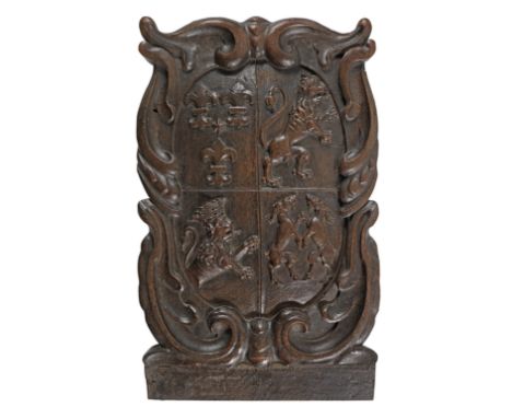 A mid-17th carved oak armorial panel, probably Netherlandish, circa 1660Carved with an unidentified quartered coat of arms, w