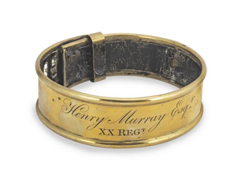 A George III brass and leather dog collar, circa 1800With leather lining and rolled rims, iron ring attachment and adjusting 