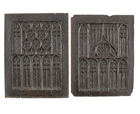 A pair of early 16th century carved oak tracery panels, circa 1500-30Each with two registers of tracery, one with its uppermo