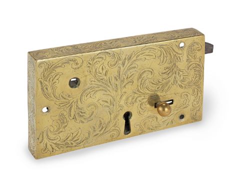 An early 18th century engraved brass and steel rim lock, English, circa 1700-30The brass box engraved with foliated scrolls, 