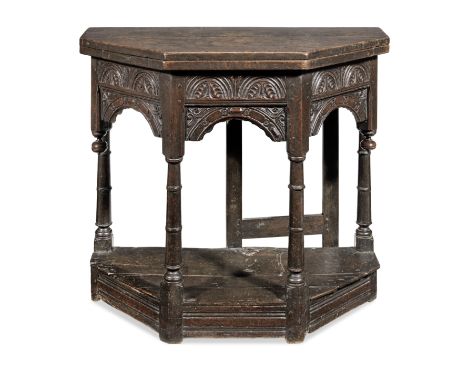 A remarkable James I joined oak folding or 'games-table', West Country, circa 1620Having a boarded octagonal folding-top, the