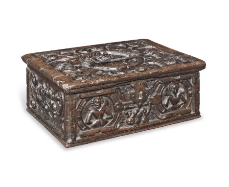 A rare and documented boarded oak box, probably Northern German, circa 1600The lid carved to its centre with a gentleman wear