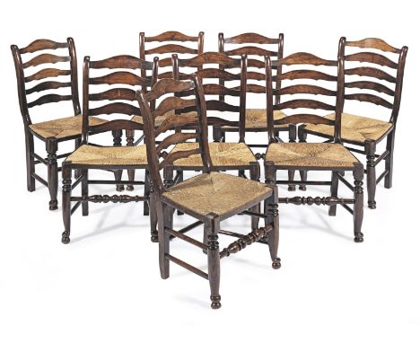 A set of eight mid-19th century ash and fruitwood ladder-back dining chairs, Ormskirk, circa 1840Each with five graduated arc