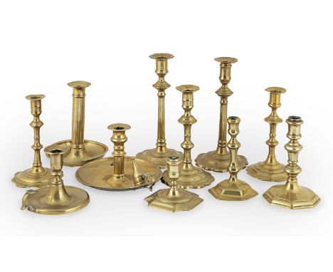 A Queen Anne/George I brass socket candletsick, circa 1710-25With facetted socket and double-knopped stem, hexagonal base, an