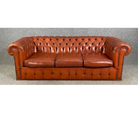 Chesterfield sofa, three seater in light tan deep buttoned and studded leather upholstery. H.65 W.200 D.92cm
