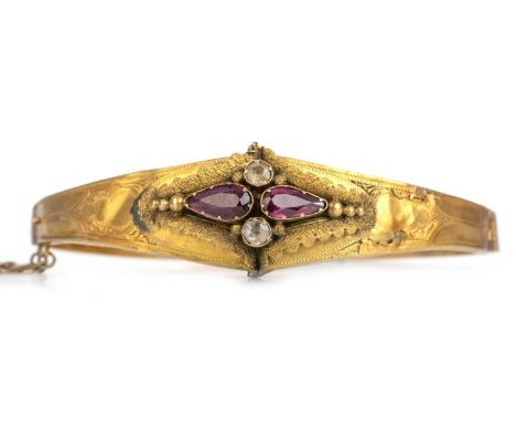 VICTORIAN RHODOLITE GARNET BANGLE, set with pear shaped rhodolite garnets interspaced by clear gemstones, unmarkedQty: 10.2g