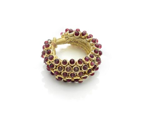 SHAKIRA CAINE: GEM-SET BEAD-LINK BRACELETOf woven gold thread, issuing a flexible ground of red glass beads, the clasp of but
