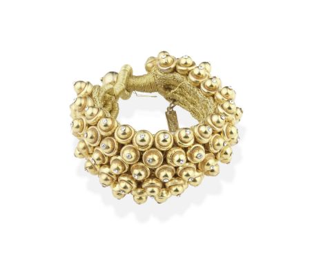 SHAKIRA CAINE: GEM-SET BEAD-LINK BRACELETOf woven gold thread, issuing a flexible ground of cup and bead links, inset with ci