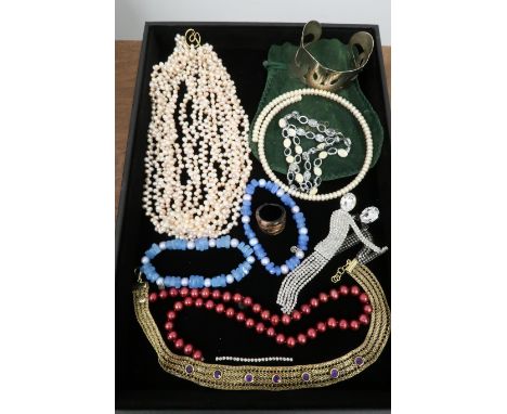 An assortment of costume jewellery to include a Butler and Wilson dancer brooch and a cuff bangle stamped 925 weight 39.95 gr