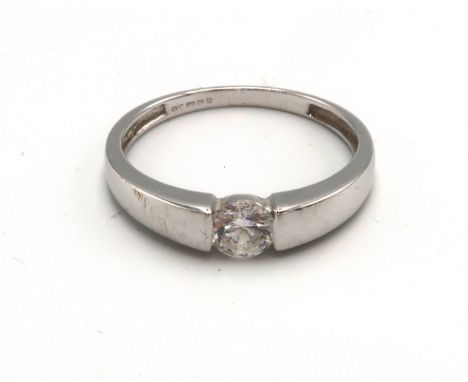A 14ct white gold and white stone ring, with flared shoulders to the inset solitaire stone, size T, 2.8g.