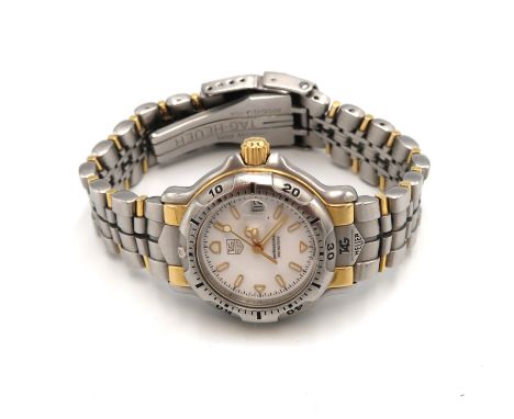 A ladies Tag Heuer quartz wristwatch with receipt for £1175 in 2002 - with box and papers, new battery fitted and in working 
