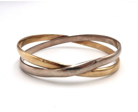 A 9ct bi-colour gold cross over bangle, 6.0  by 6.8cm internal diameter, fully hallmarked inside each bangle, 39.5g.
