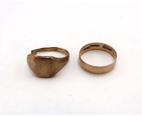 A 9ct gold 5.5mm band ring. Size S. Weight 1.80 grams. A 9ct gold signet ring with split shank. Weight 5.0 grams.