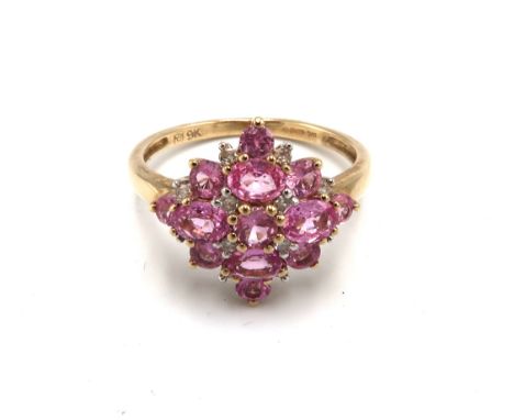 A 9ct gold pink sapphire and diamond cluster ring. Size P 1/2. Weight 2.57 grams.
