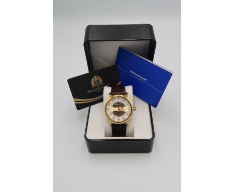A gentleman's William Hunt skeleton automatic wristwatch with leather crocodile effect strap, with original box, warrenty car