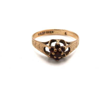 A 9ct gold and garnet flowerhead ring, a/f one garnet missing, size Q, 2.0g.