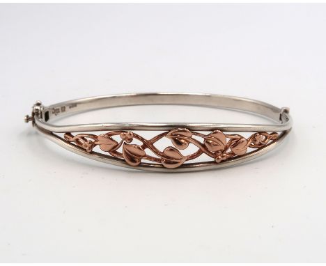 A Clogau bi colour silver bangle Weight 12.60 grams.
