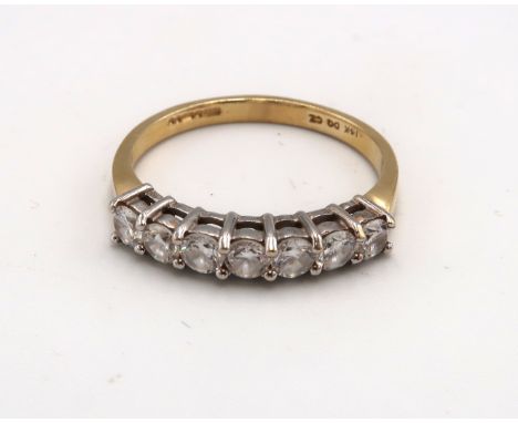 A 14ct gold and cubic zirconia seven stone ring, size Q, 2.8g