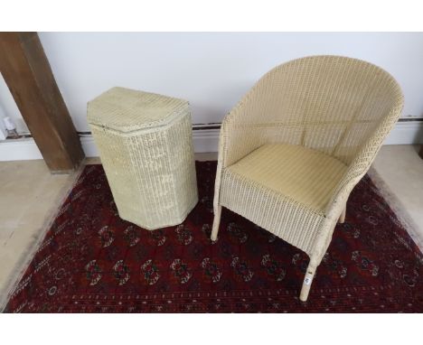 A Lloyd Loom chair and linen basket