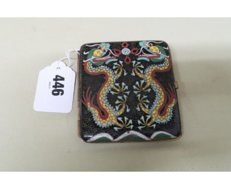 A Chinese cloisonne cigarette case the black cloud ground with yellow dragon chasing the flaming pearl to one side, and two d