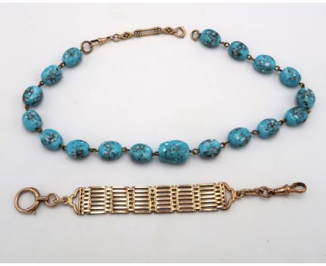A 9ct gold gate link watch holder, tested but not marked, 13.4g, and a string of blue beads with 9ct hallmarked gold part cla