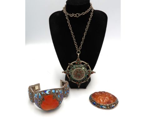 A collection of oriental jewellery. To include a meshwork bangle with central carnelian Buddha and enamel panels. Stamped sil