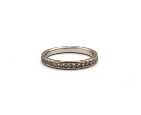 An 18ct white gold (stamped 750) diamond full eternity ring - approx weight 1.6 grams - ring size J 1/2 - would benefit from 