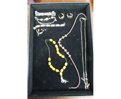 A group of silver jewellery comprising a silver and garnet necklace, silver and paste bracelet, a pair of silver gilt rose qu