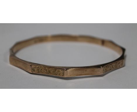 A LARGE 9ct GOLD BANGLE 