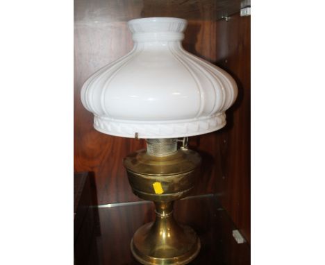 A BRASS PARAFFIN LAMP WITH SHADE 