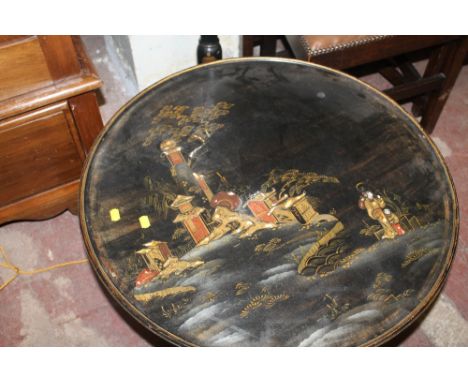 A DECORATIVE EBONISED ORIENTAL STANDARD LAMP WITH SIMILARLY DECORATED COFFEE TABLE 