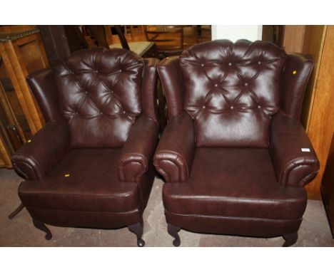 A PAIR OF BROWN LEATHER BUTTON BACK ARM CHAIRS 