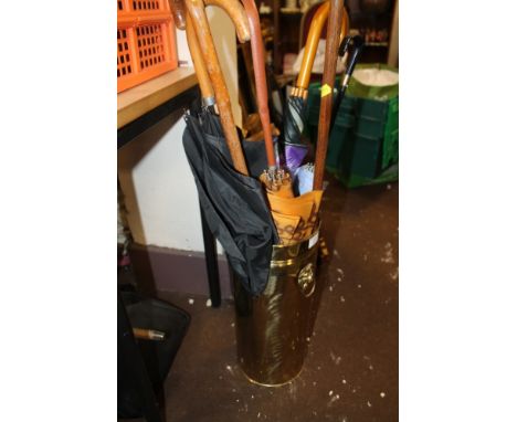 A BRASS STICK STAND AND CONTENTS