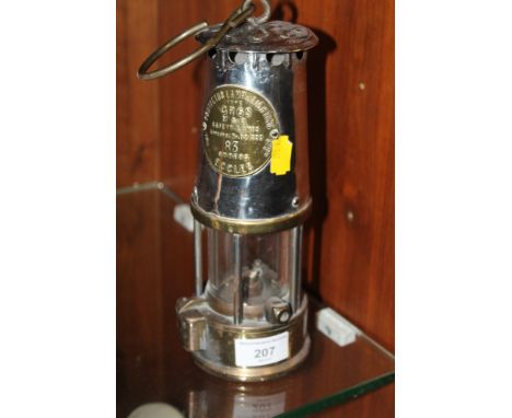 A BRASS AND METAL MINERS LAMP 