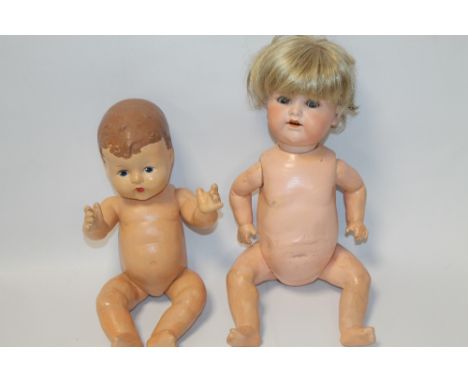 AN ARMAND MARSEILLE BISQUE HEADED DOLL TOGETHER WITH ANOTHER DOLL 
