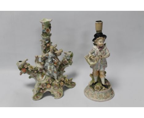 A DRESDEN SITZENDORF MARKED CANDLE HOLDER DECORATED WITH A BOY AND FLOWER BASKET TOGETHER WITH A CONTINENTAL THREE LIGHT CAND